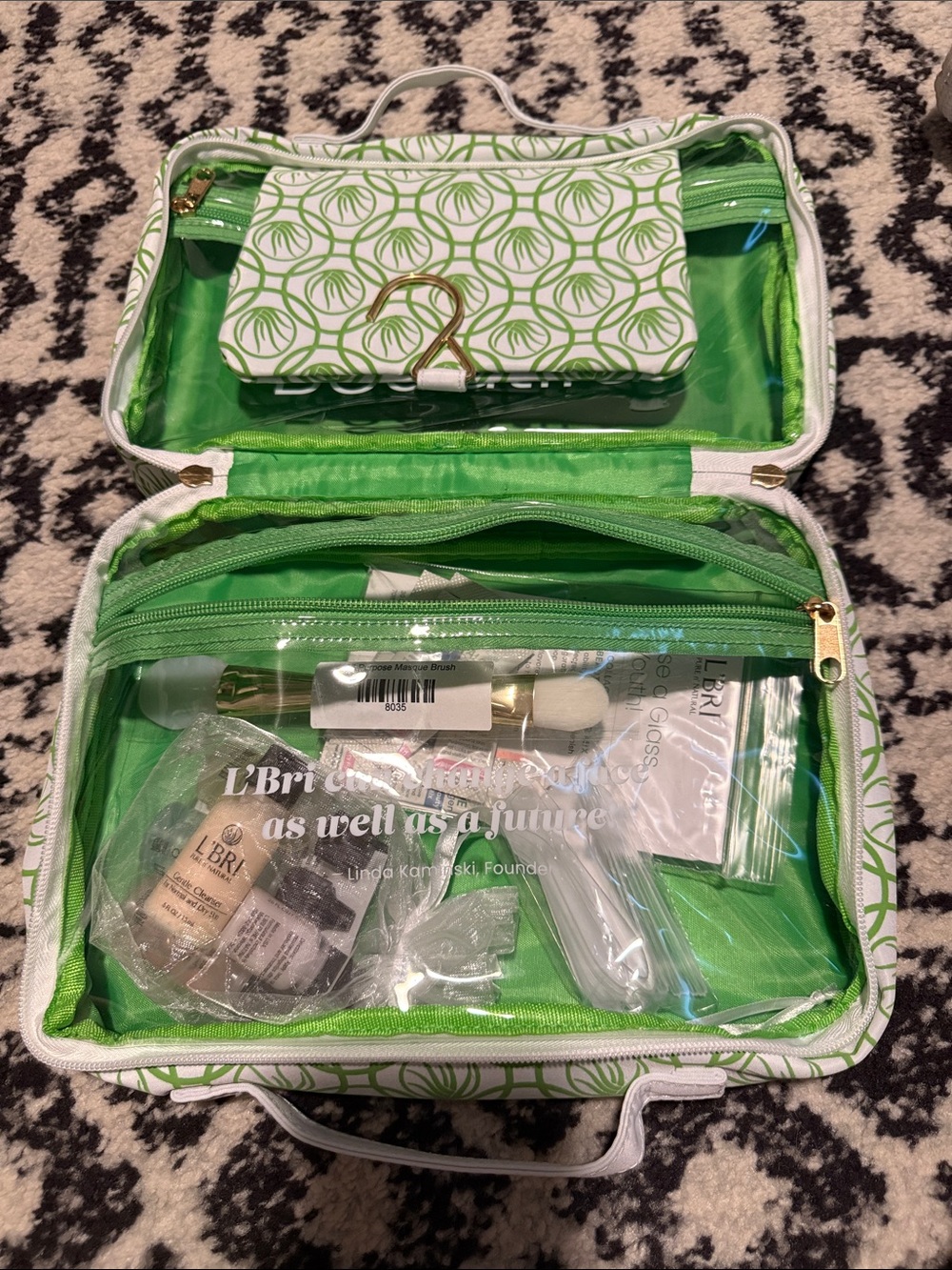 L’Bri travel bag with skincare samples